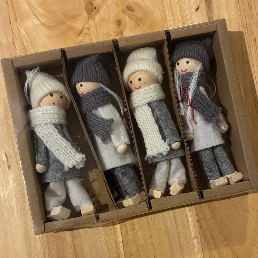Set of Four Wooden Winter Figurine ornaments in shades of grey and white